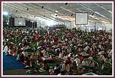 Devotees enter the assembly hall for the Vishvashanti Mahayagna