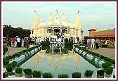 A splendid reflection of the Mandir in the pool as devotees go for darshan