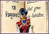 Shri Harikrishna Maharaj seated on a shastra float 