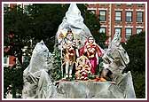 Shri Shiv-Parvati Dev seated on a float representing Mount Kailas