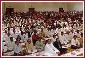 Devotees participating in the mahapuja ceremony