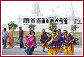 Children dressed in traditional costumes  dance with joy at the occasion  