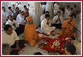 Devotees participate in the mahapuja vidhi for the murti prathistha  