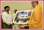  P. Yagnavallabh Swami presents the Deputy Consul General of India, K. P. Pillai with a photograph of the Mandir