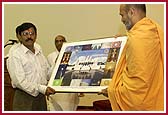P. Yagnavallabh Swami presents the Deputy Consul General of India, K. P. Pillai with a photograph of the Mandir