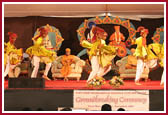 Children dressed in traditional costumes dance with joy at the occasion 