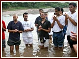 Kishores perform dhoon in the sacred Undh river in Bhadra