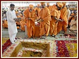  Sadhus place cement in the foundation