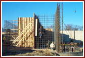 Erecting the front and the north basement level walls of the Haveli