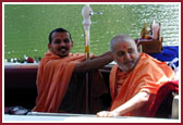 Shri Harikrishna Maharaj, Lord Ganeshji, Swamishri and saints observing the traditional boat ride.