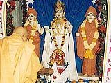 Performing puja of the Lord's murti on Gunatitanand Swami diksha day.