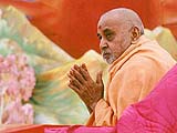 Bowing to devotees after his puja
