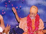 'Showering flower petals on children and youths who performed a stage drama on Shastriji Maharajs life