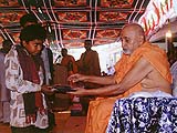 Distributing clothes to tribal children
