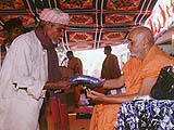 'Distributing clothes to tribal senior citizens