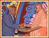 Presenting a plaque to the Minister of Home Affairs, Hon. Shariff Nassir 24 Aug 99