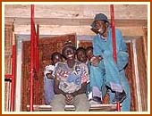 Happy African laborers in the Mandir, 26 Aug 99 