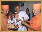 Blessing a baby child.