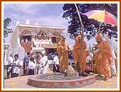 Swamishri worshipping a tree sanctified by Yogiji Maharaj