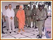 Swamishri with Mayurbhai Madhvani and the security officers, Kakira