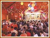 Performing morning puja at the mandir, 6 Oct 99 