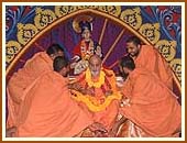 Swamishri being garlanded by sadhus appointed at Nairobi mandir, 20 Oct 99