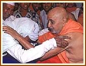 Affectionately blessing an old devotee