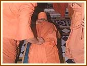 Prostrating at the memorial shrine of Shriji Maharaj, Laxmivadi