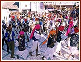 Tribal devotees perform a welcome dance for Swamishri on his arrival to the Murti Pratishtha assembly