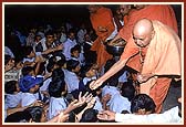 Distributing prasad to disabled boys