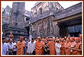 A guide explaining the history of the Kailash mandir