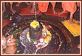 Swamishri worshipping the Shivaling of Ghrushneshwara mandir - one of India's twelve Jyotirlingas