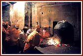 Reverentially touching the holy Shivlinga of Kailash mandir