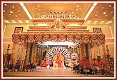 The grand decorated stage of the Kalyan Mandap assembly hall