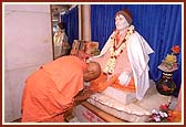 Bowing before the murti of Shastriji Maharaj on his birth place