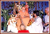 After a tribal dance, Swamishri inquires about the musical instrument played by a tribal devotee