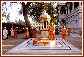 Swamishri circumambulating the shrine in memory of the place where Shastriji Maharaj gave spiritual discourses during the construction of the mandir