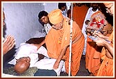 Blessing a patient at the Sanstha's Vadodaria Hospital