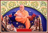 Engrossed in reading a devotee's letter during the decennial anniversary assembly 