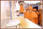 Touching the symbolic footprints of Lord Swaminarayan while circumambulating the mandir