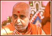 Swamishri engaged in his morning puja and concludes it by humbly bowing to all with folded hands