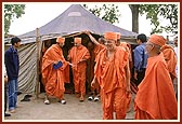 Swamishri comes out from the tent at the site