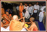 Giving prasad to the devotees