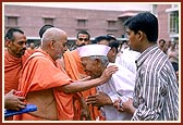 Blessing and patiently listening to senior devotees