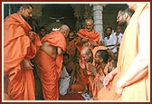 Humbly bowing to sadhus on Pramukh Varni Din Celebration
