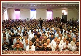 An assembly of devotees in the mandir