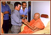 Swamshri meeting Bernadino, once a deaf and dumb boy is now normal through Swamishri's blessings