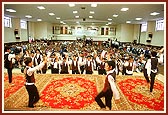 Children performing a marching-song in honor of Thakorji and Swamishri