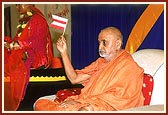 Swamishri also waves a flag during the marching-song