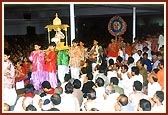 Lord Harikrishna Maharaj being brought in a decorated planquin